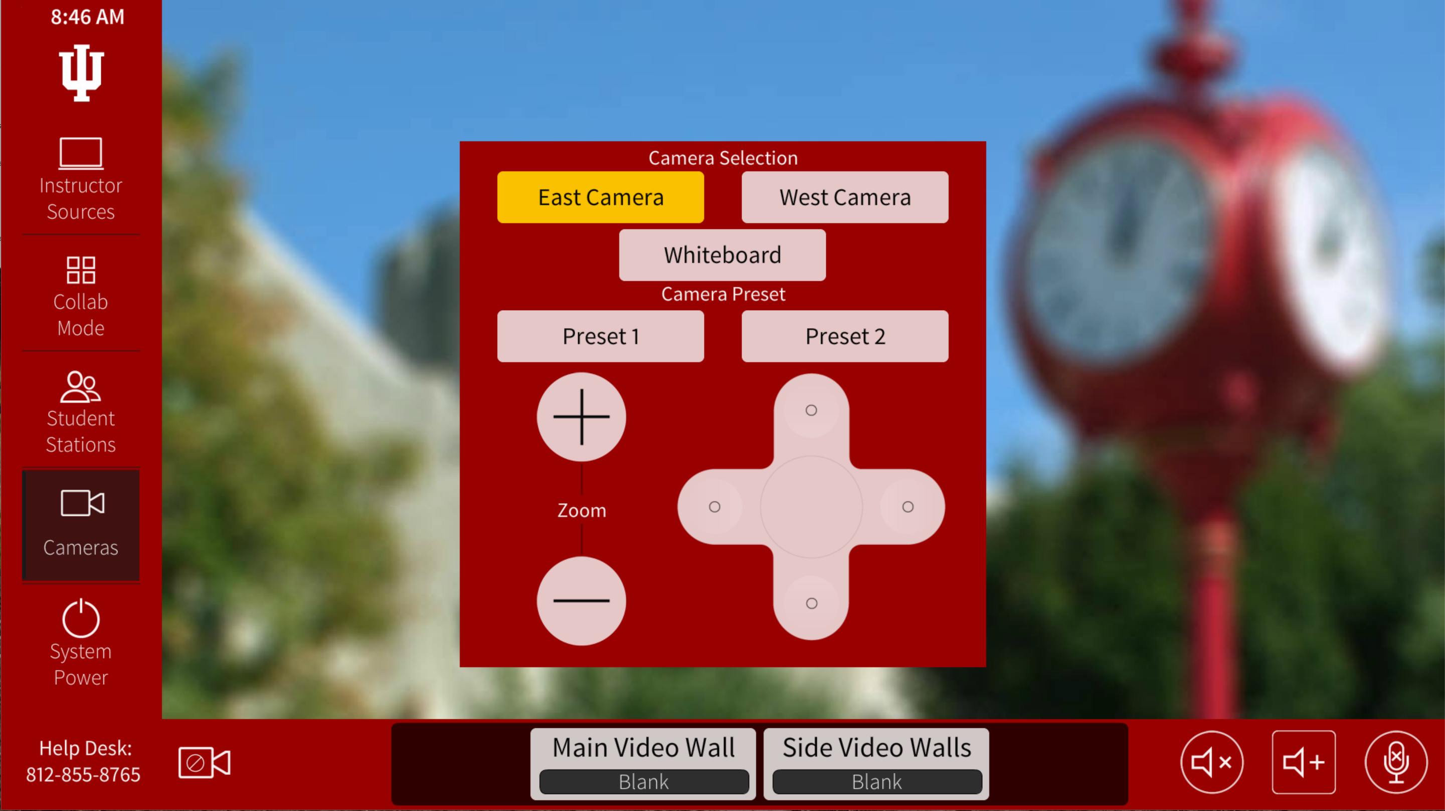 SB015 Instructor Control Panel showing "Cameras" options: "East Camera," "West Camera," "Whiteboard," "Preset 1," "Preset 2," zoom + and - buttons, and 4-directional movement for the cameras.