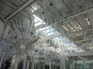 Photo of a crystalline sculpture, "Amatria", suspended in the atrium of Luddy Hall.
