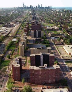 An aerial view of high rise apartments with the Chicago skyline in the background.