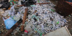 A pile of used syringes for heroin in a jade mining town.