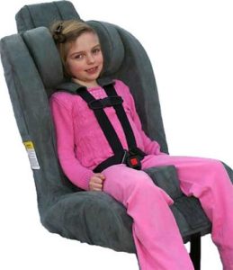 Child sitting in a large medical seat