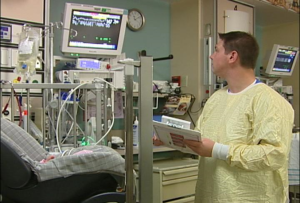 Nurse observing preterm infant for apnea, bradycardia, oxygen desaturation in conventional car seat