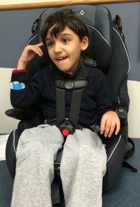 Child with cerebral palsy in combination car seat; Source: Automotive Safety Program