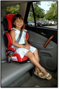 Child sitting in a high-back booster seat