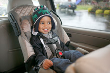 Child in a rear-facing convertible car seat