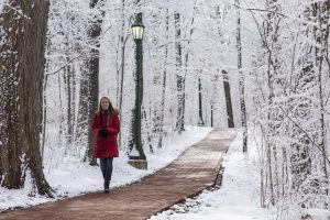 Image of student walking through the Bloomington campus on a winter day.