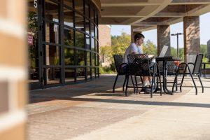 Student studying outside at IU East.