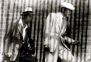 Scene from Akira Kurosawa's 1949 crime drama Stray Dog. Detective Murakami and Sato intensely track a suspect