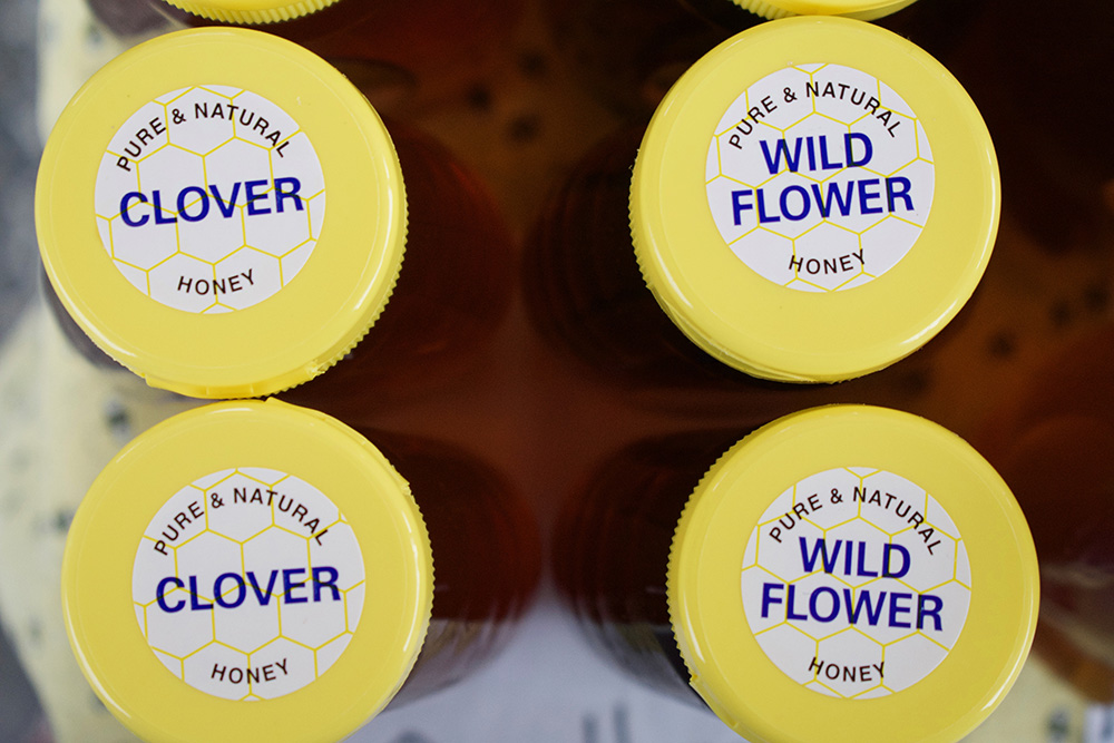 Bottles of clover and wildflower honey