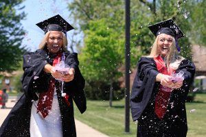 Graduates celebrate after the IU Northwest Commencement.