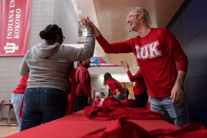 Students exchange a high five before a pep rally at Indiana University Kokomo.
