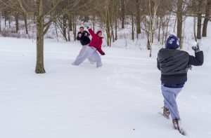 Students participating in an impromptu snowball fight at IU Bloomington.