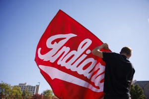 The IU flag being set up before the Indiana University Homecoming parade.