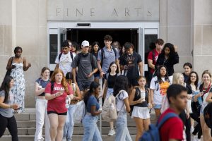 Students emerge from the Fine Arts Building during the first day of fall semester classes at IU Bloomington.