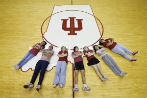 Students posing in the Simon Skjodt Assembly Hall.