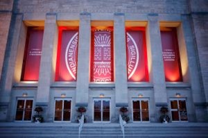 Image of IU Auditorium with the seal banner graphic on the front.