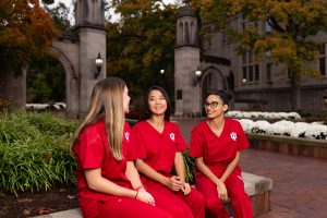 Indiana University School of Nursing students chat outside Bloomington’s campus.