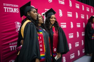 Graduates pose for a picture before the IU South Bend Commencement at the Joyce Center.