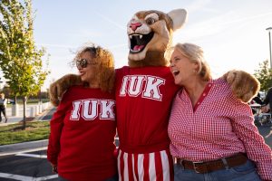 Image of the mascot and fans posing for a photo during the homecoming tailgate at Indiana University Kokomo.