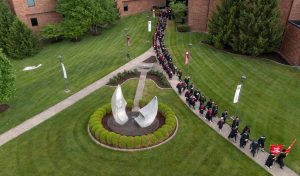 IU Southeast Commencement participants make their way from the Ogle Center.