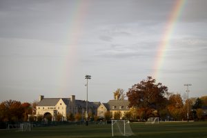 A double rainbow breaks through the sky along Woodlawn Avenue on a fall day at IU Bloomington.