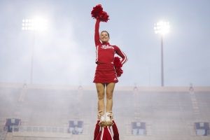 Indiana University cheerleaders pump up the crowd during Traditions and Spirit of IU in Memorial Stadium at IU Bloomington.