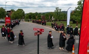 Degree candidates march to the ceremony for the IU Southeast Commencement.