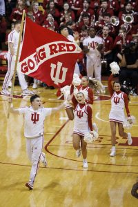 IU cheerleaders take the court with a Go Big Red flag during a NCAA men’s basketball game at Simon Skjodt Assembly Hall.