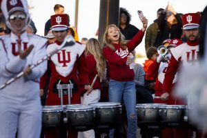 A student reacts as the Indiana University Marching Hundred.