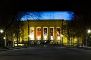 Image of the Indiana University Auditorium lit in the evening.