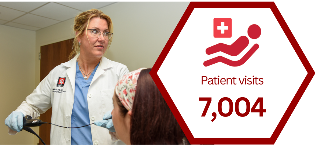 Physician using scope on patient