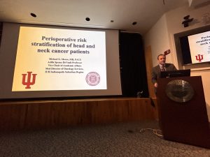 Faculty member presenting at podium