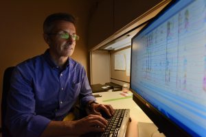 Researcher working at computer