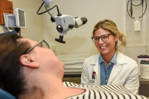 Physician consulting with patient