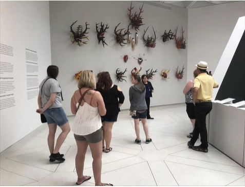 A photo of people in a museum.