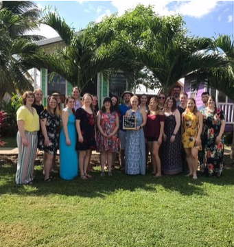 A photo of a group posing for a photo.