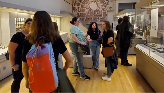 A photo of a group of people exploring the museum.