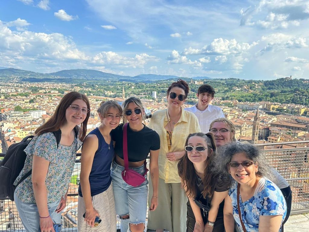 Image of a group of people posing at the top of Brunelleschi’s Dome.