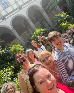 A photo of a group of people in a garden.