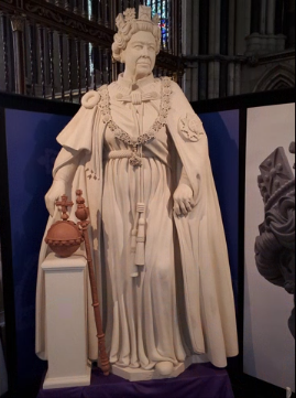 A photo of a statue of Queen Elizabeth II.