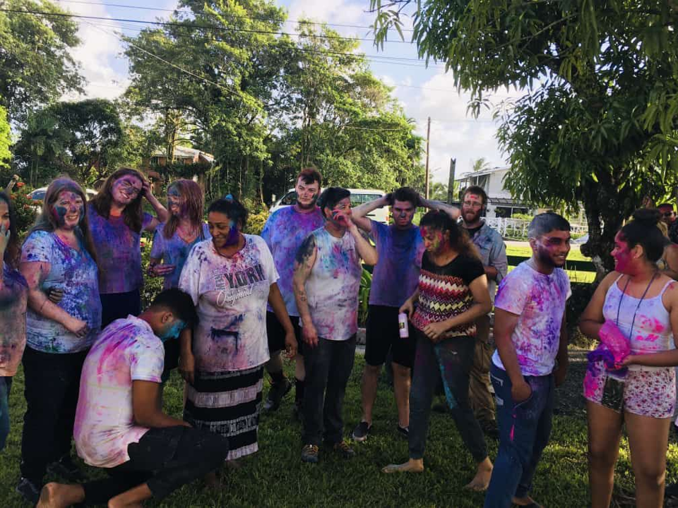 Image of a group of people covered in paint.