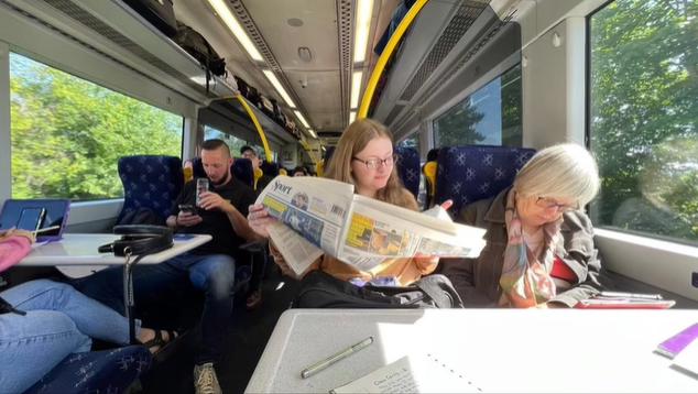 A photo of people on a train.