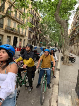 A photo of a group of people riding their bikes.