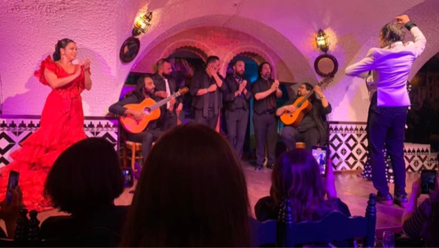 A photo of flamenco dancers performing.