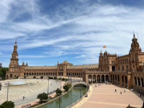 A photo of a building and a courtyard.