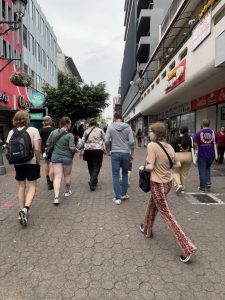 A group of people walking in a city.