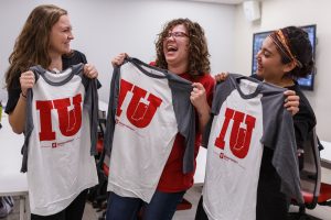 Students showing off their Indiana University Fort Wayne t-shirts.