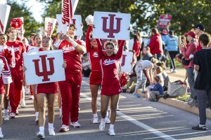 IU cheerleaders participating in the homecoming parade.