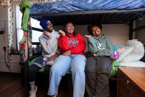 IU Indianapolis roommates pose together in their dorm room.