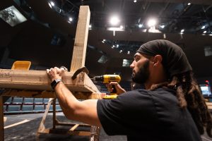 Student building a theatre set at IU Southeast.